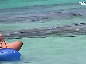 Topless teens having fun in the water