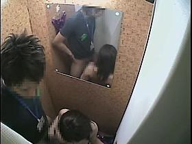 Handy Asian bimbo performing handjob in the changing room