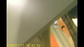 Trying on cloths and posing before mirror in bra