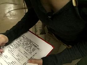 Hot asian babe is being filmed upskirt on the street