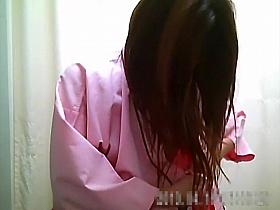 Spycam in the dressing room films some Asian babes changing