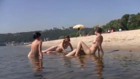 Shy girl pops her top off for all the beach goers