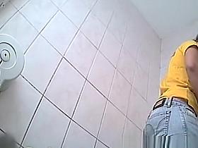 Gir in yellow t-shirt peeing