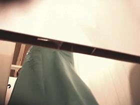 Trying on the luxurious night dresses in a fitting room