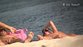 Bare pussy on a sandy beach exposed to crafty voyeur cameras