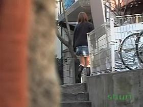 Slim Asian babe skirt sharked in a narrow passage.