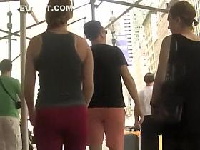 Ponytail girl in red leggings walking