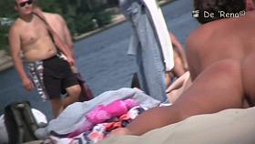 Stunning tanned brunette with a neat pussy in a beach porno video