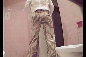 Leggy tan girl with milky white ass pissing in the toilet