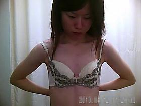 Hidden camera in the dressing room films Asian chicks chang