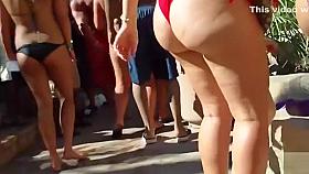 Delightful babes wearing bikinis bounce with their big booties