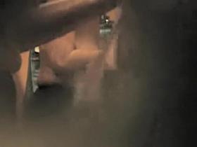 Girl in back bra seems to have noticed a hole in the wall