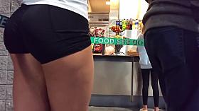 Volleyball player's deliciously round ass in line