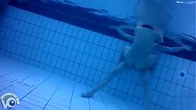 Nudists in the pool get filmed underwater
