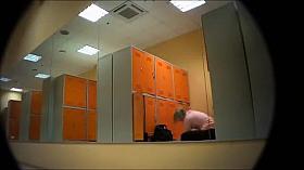 Hot lady getting dressed in a locker room