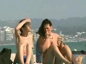 2 friends get naughty on the beach