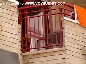 Upskirt of a neighbor at a balcony