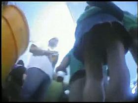 Young teens do not notice the camera that is filming their tight asses