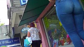 Incredibly HOT brunette with a PHAT ass in skintight jeans!