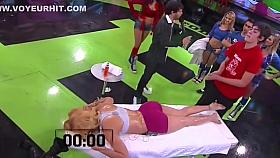 Athletic lady receives a massage live on the television