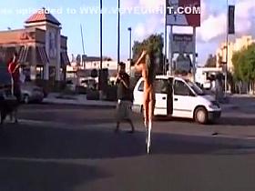 Naked goddess in boots gets attention in public