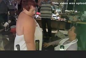 Elderly woman doing a striptease