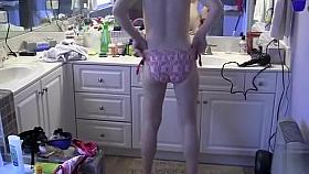 My girlfriend with perky tits puts on her bikini