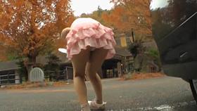 Asian teen bends over and shows horny upskirt in the street