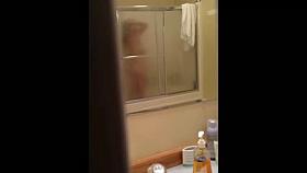 Aunt in the shower - door slightly opened