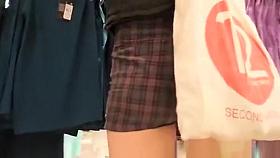 Blonde girl in clothes store