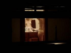 Curvy babe caught naked in the bathroom by a window voyeur