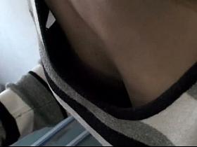 Slender Asian chick lets a down blouse perv inside her cleavage