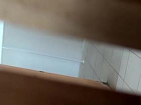 Asian woman in glasses spied in public toilet