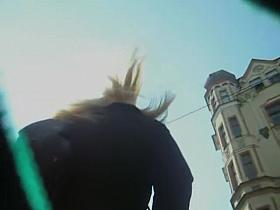 Pantyhose ass of the upskirt babe caught in the street
