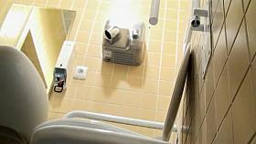 Sideways view of a hot pissing woman