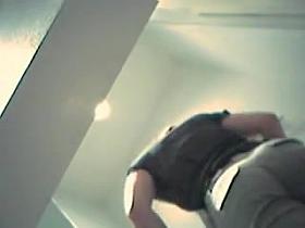 Girl in dressing room without top and then without jeans