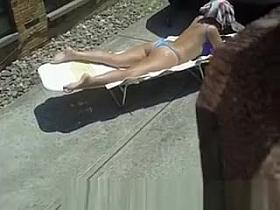 Spy sunbathing