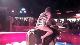 Fabulous babe has her crotch revealed while riding the bull