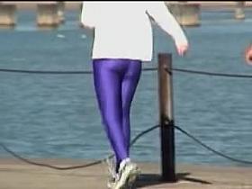 Candid amateur in lilac pantyhose walking along the quay 03zm
