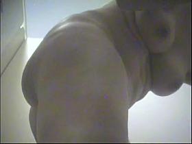 A naked milf wiping herself after shower