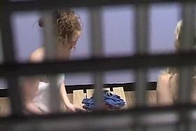 Two sexy girls in fitness locker room