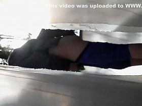 Funny catch of a girl wiping with leaves