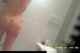 Old lady seats in toilet to pee and shower