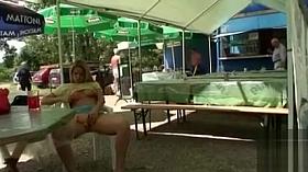 Busty blonde posing when fingering the pussy in public