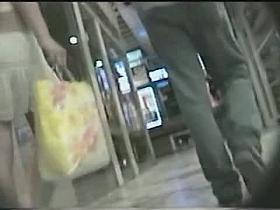 Two cuties captured by an upskirt cam