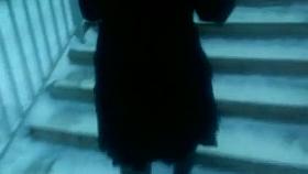 Chick flashing her black stockings with the red tops outdoor