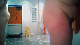 Girls in changing room are in bath robes and also naked