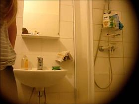 Nude blonde's hot curves in bathroom