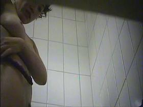 Sexy chick flashes hairy nub changing in the changing room