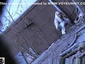 Blonde girl pees outside